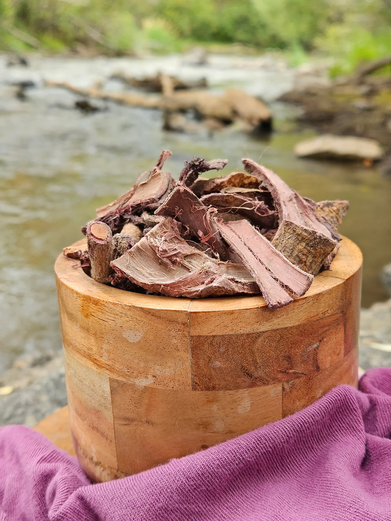 Mimosa Hostilis root bark chips in an acacia wood bowl