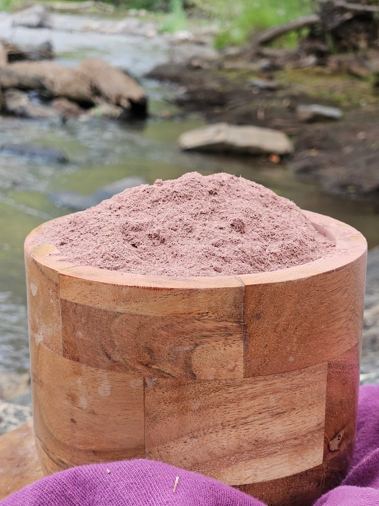 Mimosa Hostilis root bark powder in an acacia wood bowl